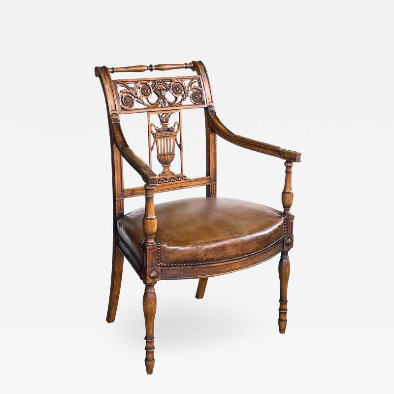 Italian Neoclassical carved fruitwood armchair with leather seat