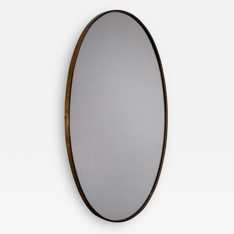 Italian oval brass mirror with beaded decoration