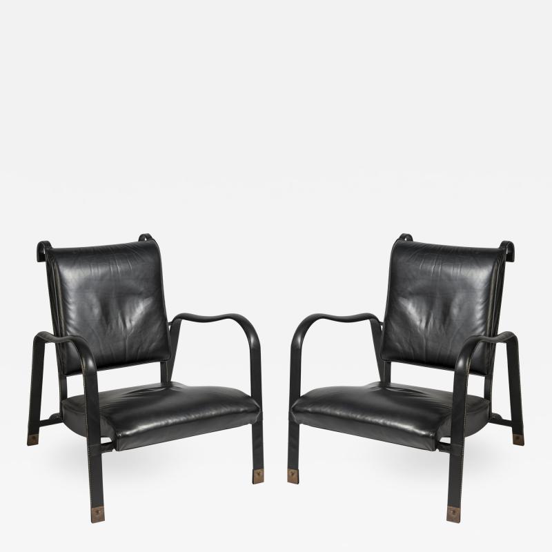 Jacques Adnet Pair of Stitched leather armchairs by Jacques adnet