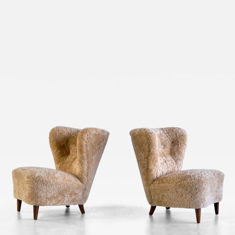 Johannes Brynte Pair of Johannes Brynte Lounge Chairs in Sheepskin and Ash Wood Sweden 1940s