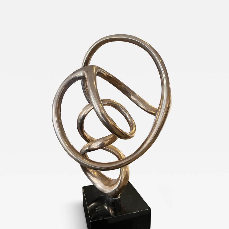 Kieff Antonio Grediaga Bronze sculpture of a twirling abstract form set on a black base