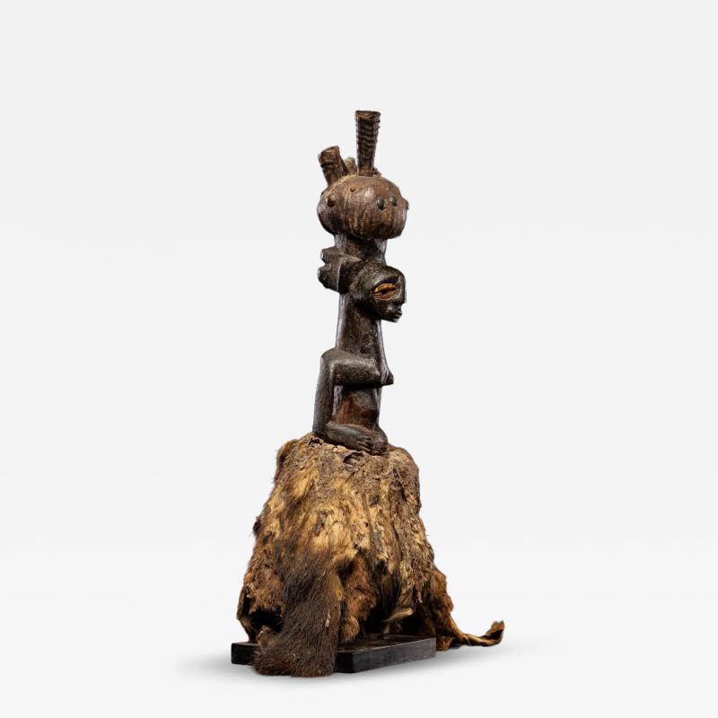 Kusu Power figure with cauris inlaid eyes topped with small antilope horns