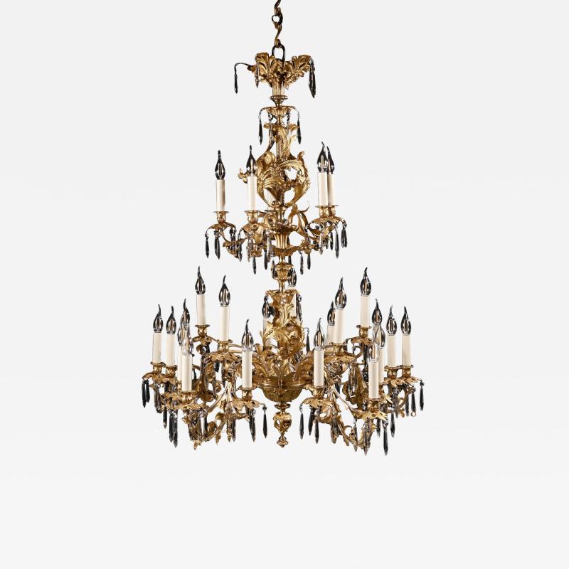 LOUIS XV STYLE GILT BRONZE AND CUT GLASS TWENTY FIVE LIGHT CHANDELIER