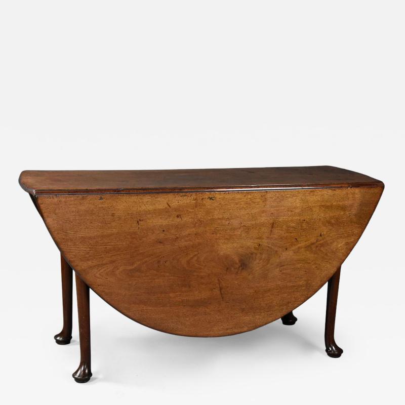 Large 18thc solid walnut drop leaf dining table of fine faded patina