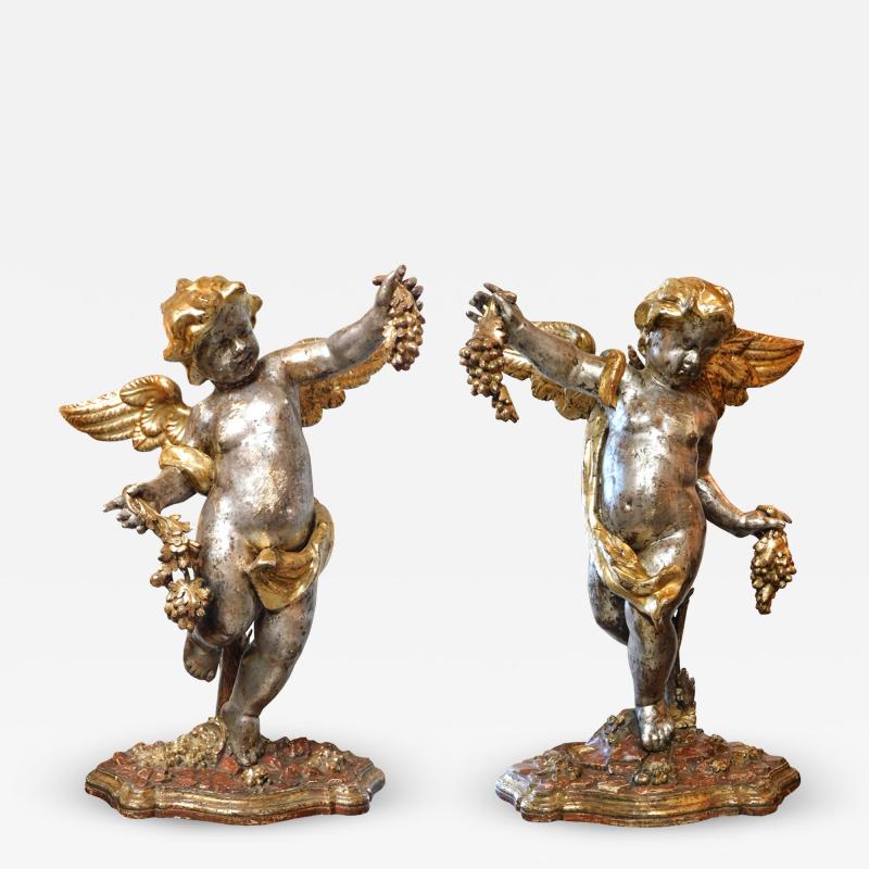 Large Pair of Roman Rococo Carved Giltwood Putti Harvesting Grapes