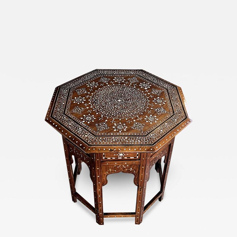 Large and intricately inlaid Anglo Indian octagonal side traveling table