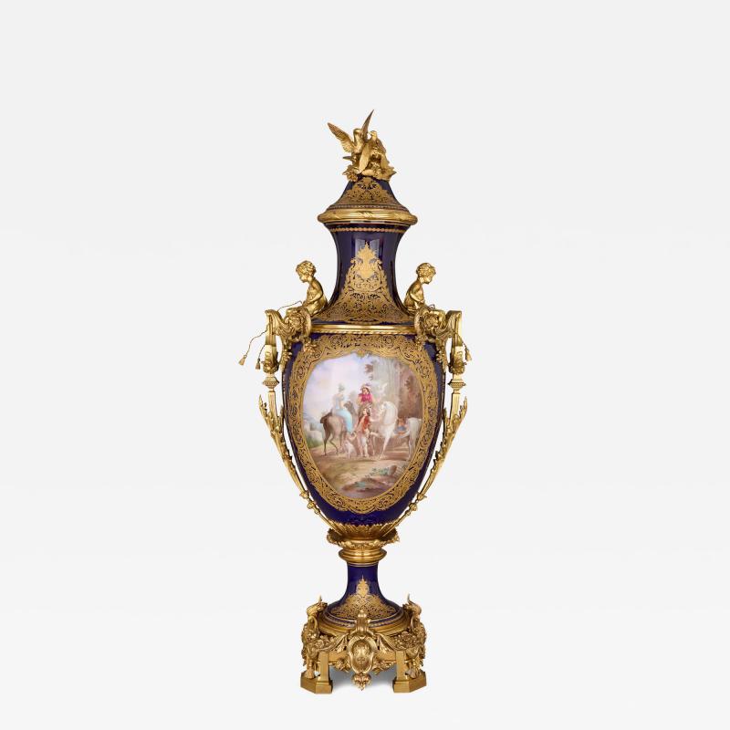 Large antique porcelain and ormolu vase painted with a genre scene
