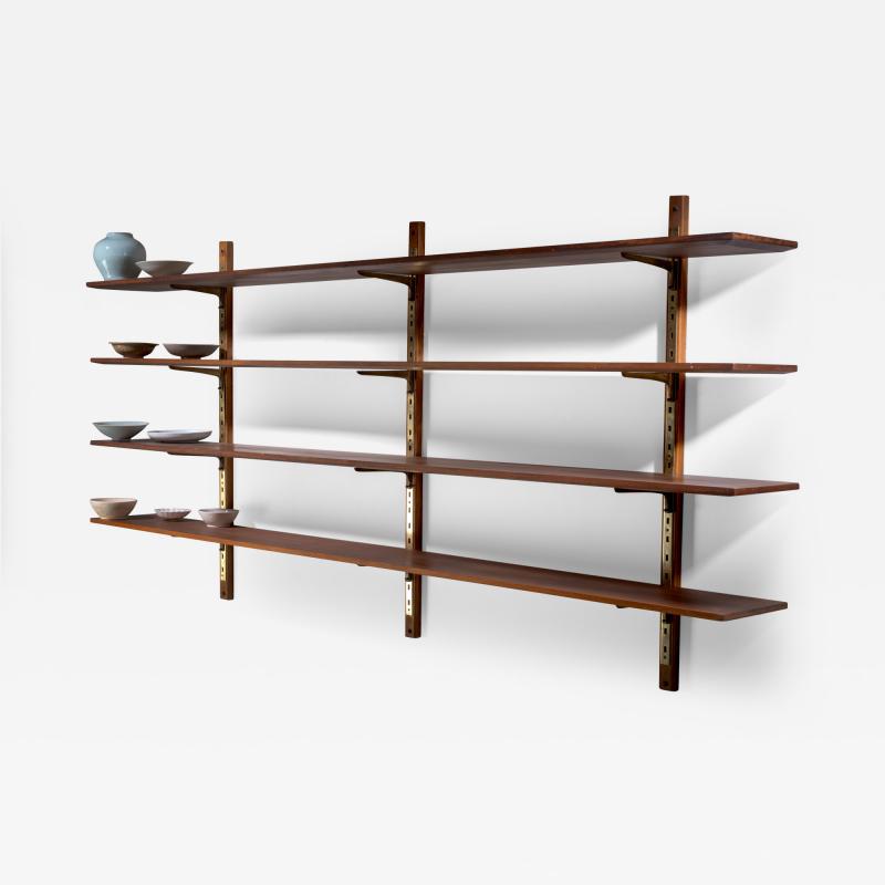 Large shelving unit with brass brackets