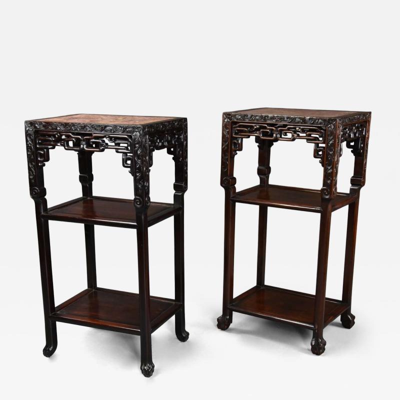 Late 19thc matched pair of freestanding Chinese hardwood pot stands