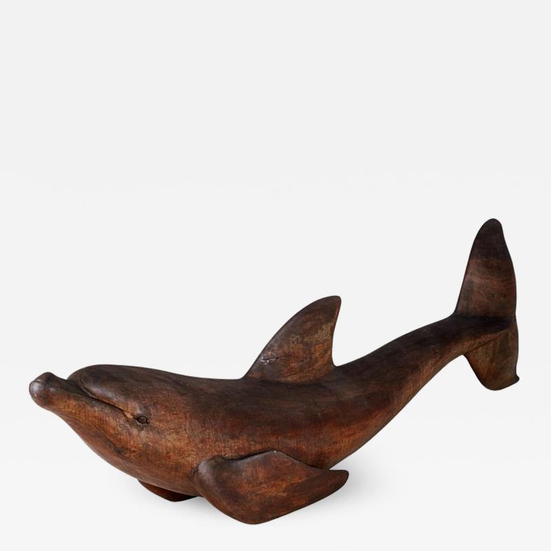 Lifesize carved wood sculpture of dolphin