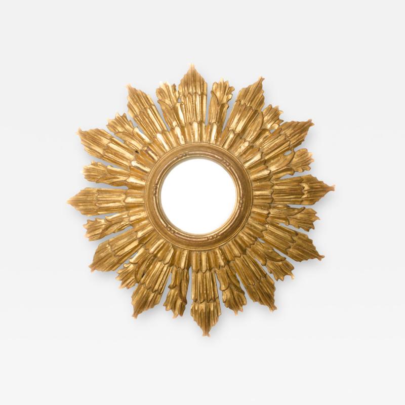 Line Vautrin A small gilt wood sunburst mirror in the manner of Line Vautrin