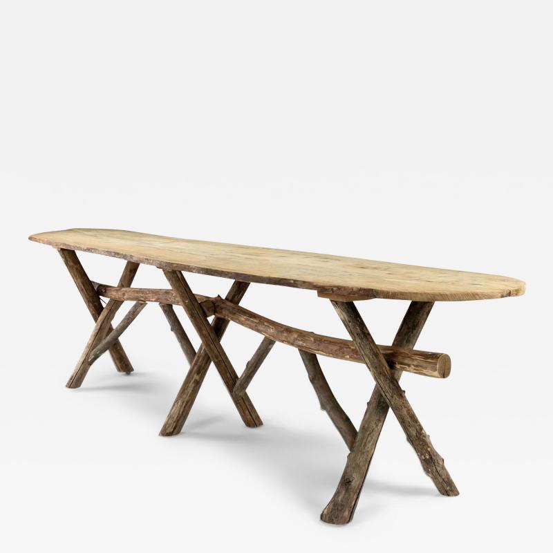 Long Live Edge Oval Top Table with Natural Shaped Trestle Base
