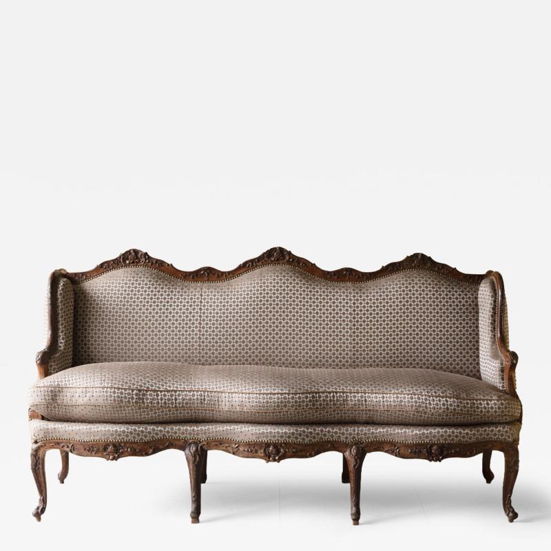 Louis Cresson LOUIS XV WALNUT WING BACK CANAP OR SOFA