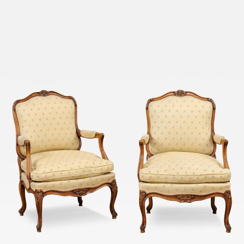 Louis XV Style French Walnut Fauteuils la Reine with Carved Floral Motifs