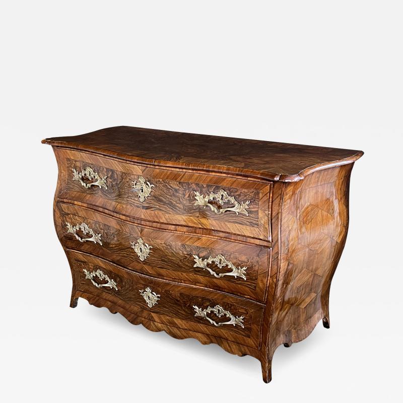 Louis XV three drawer black walnut bombe form chest