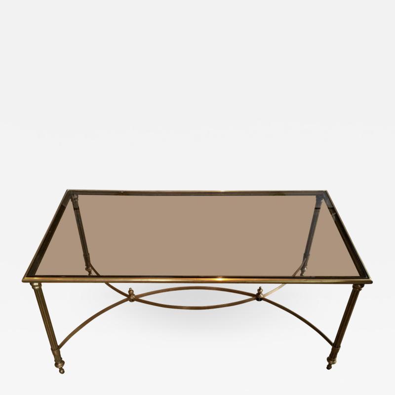 MID CENTURY BRASS SMOKED GLASS COFFEE TABLE WITH CURVED STRETCHER
