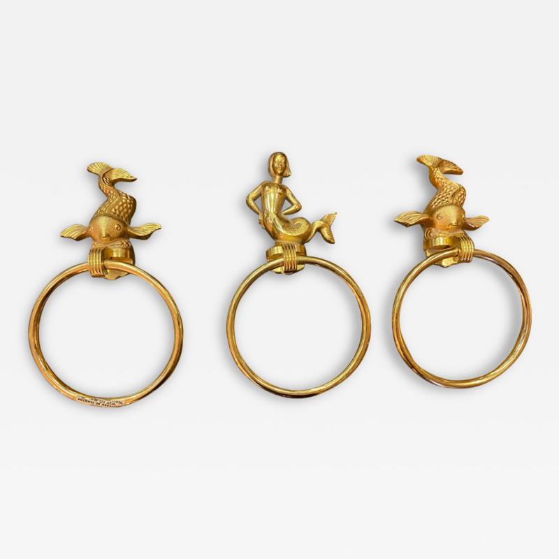 MID CENTURY TRIO OF GOLD PLATED BRASS DOLPHINS AND MERMAID TOWEL RINGS