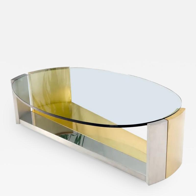 MODERNIST BRASS AND CHROME OVAL COFFEE TABLE IN THE MANNER OF MARIA PERGAY
