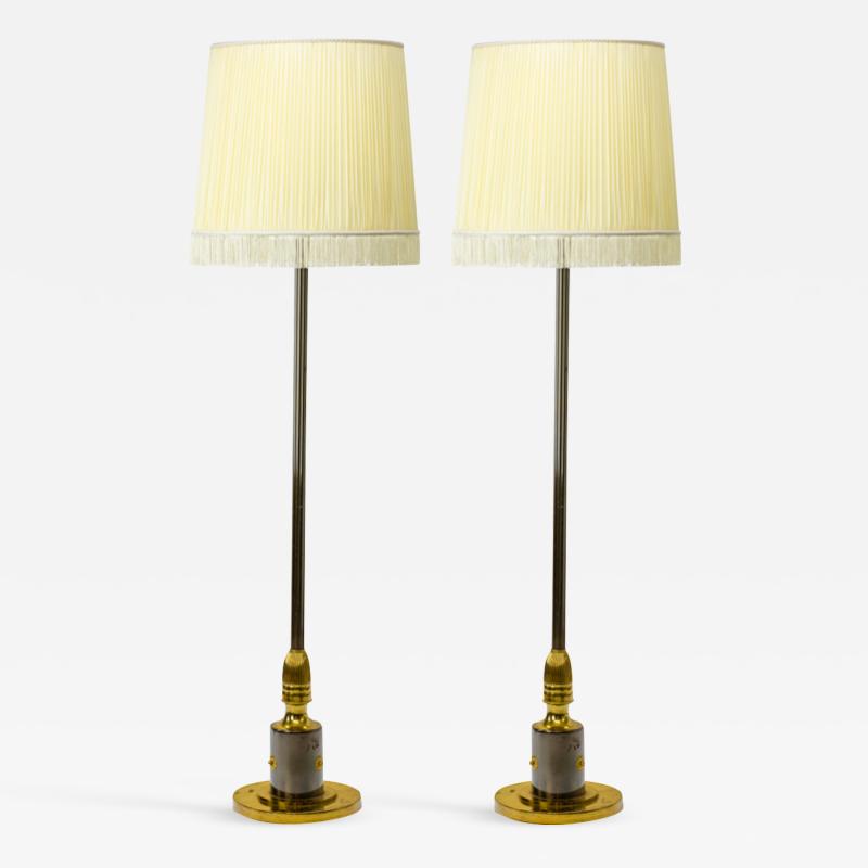 Maison Jansen Maison Jansen pair of refined gold bronze and cannonball patina floor lamps