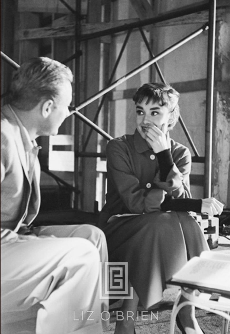 Mark Shaw Audrey Hepburn and William Holden on the set of Sabrina Hand on Face 1953