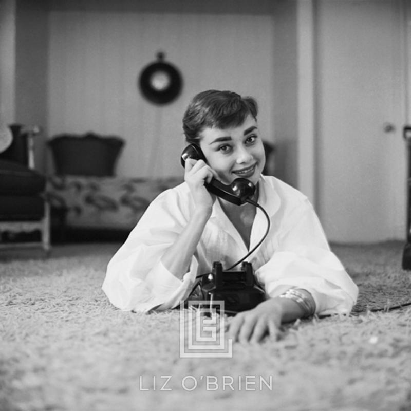 Mark Shaw Audrey Hepburn in White Blouse with Phone Laying Hand on Receiver