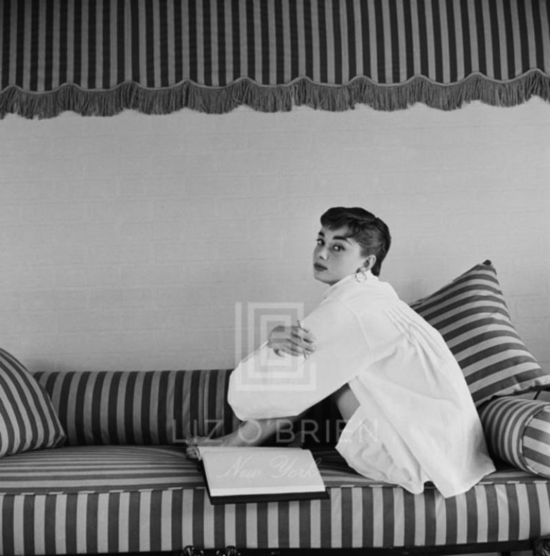 Mark Shaw Audrey Hepburn on Striped Sofa Hugs Knees 1954