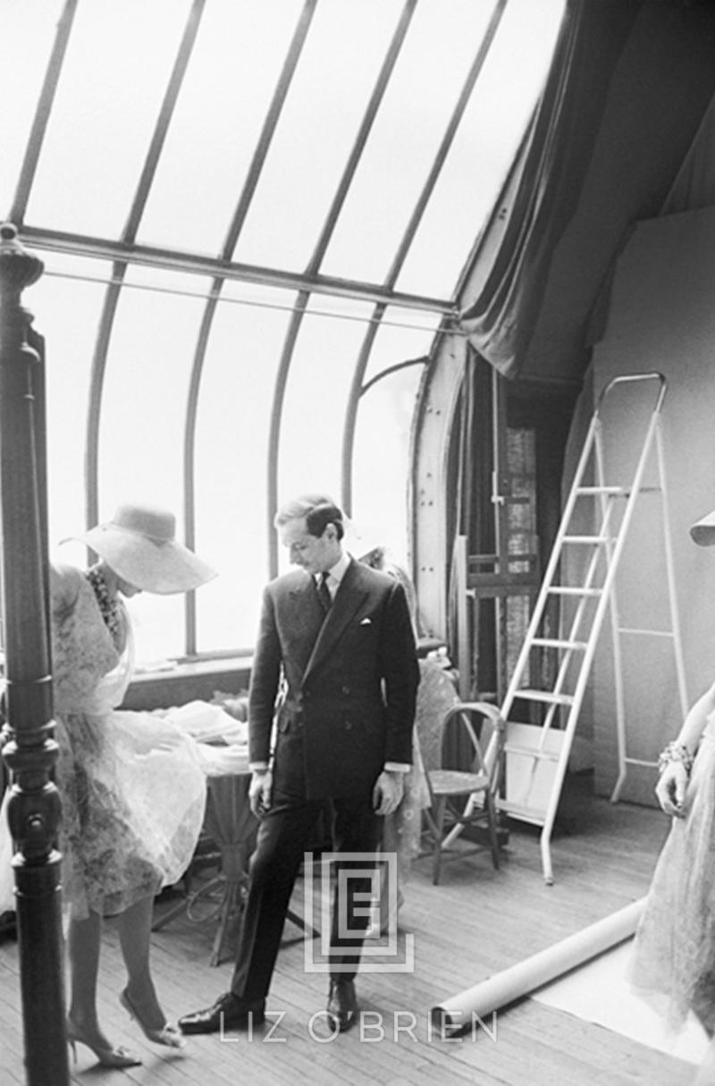 Mark Shaw Dior designer Marc Bohan shown with a model in his salon 1961