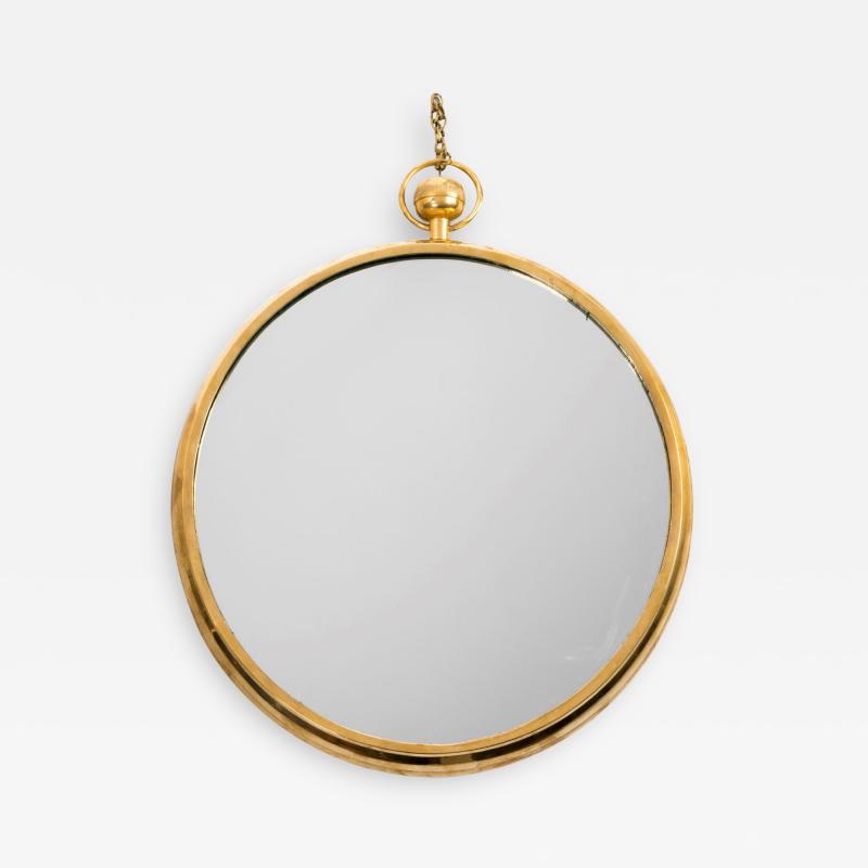 Mid Century Modern brass mirror in the manner of Fornasetti