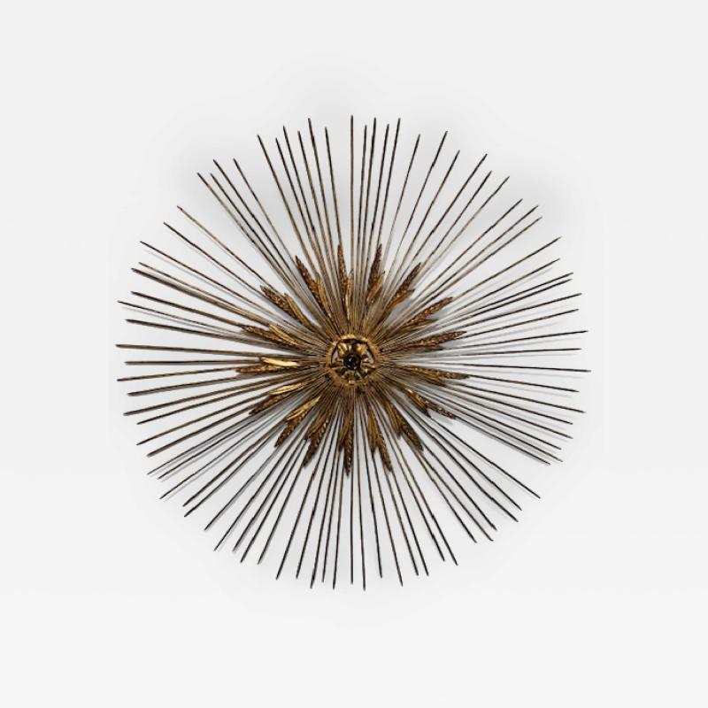 Mid Century gilt metal sunburst with spoke and wheat design