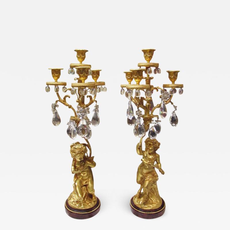 Nice pair of 1860 girandoles in gilded bronze with crystal pendants