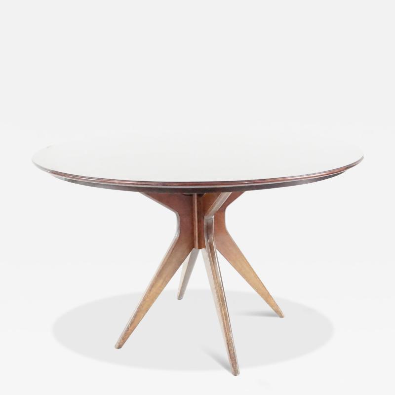 Osvaldo Borsani Osvaldo Borsani round dining table walnut four feet circa 1951