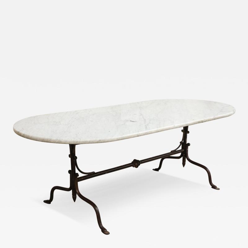 Oval Marble Topped Dining Table with Trestle Iron Base France mid 20th c