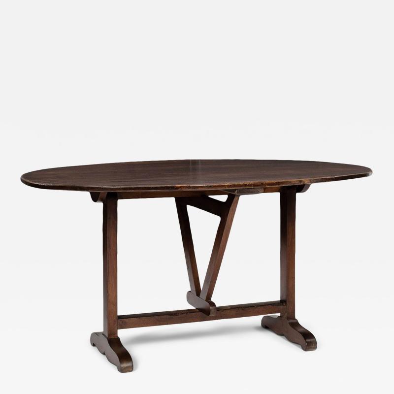 Oval Tilt Top Walnut Table
