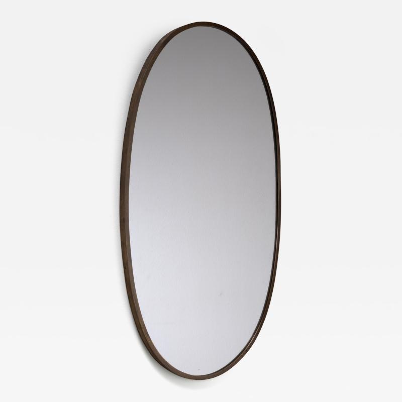 Oval brass wall mirror