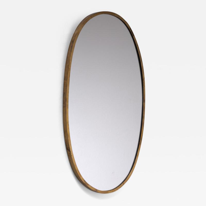 Oval brass wall mirror