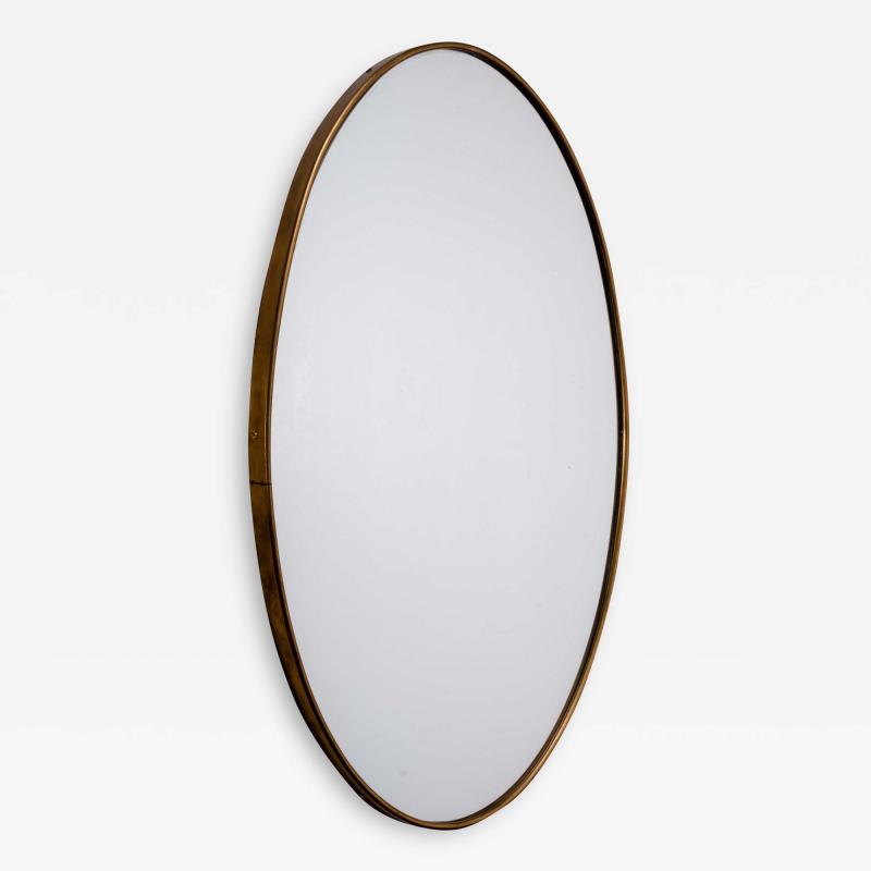 Oval brass wall mirror Italy