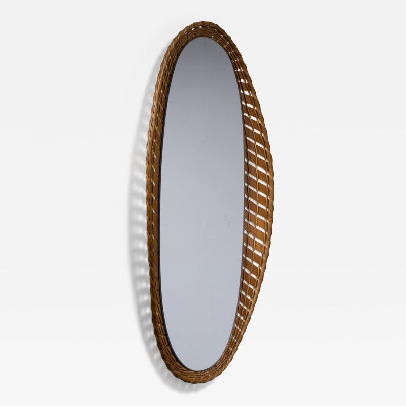 Oval wall mirror with a wooden and rattan frame