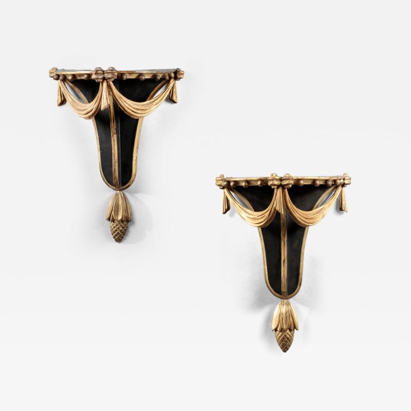 PAIR OF CARVED EBONIZED AND GILDED BRACKETS