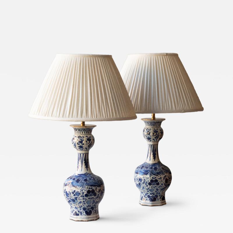 PAIR OF DUTCH DELFT BLUE AND WHITE WAISTED BOTTLE VASES CONVERTED TO LAMPS