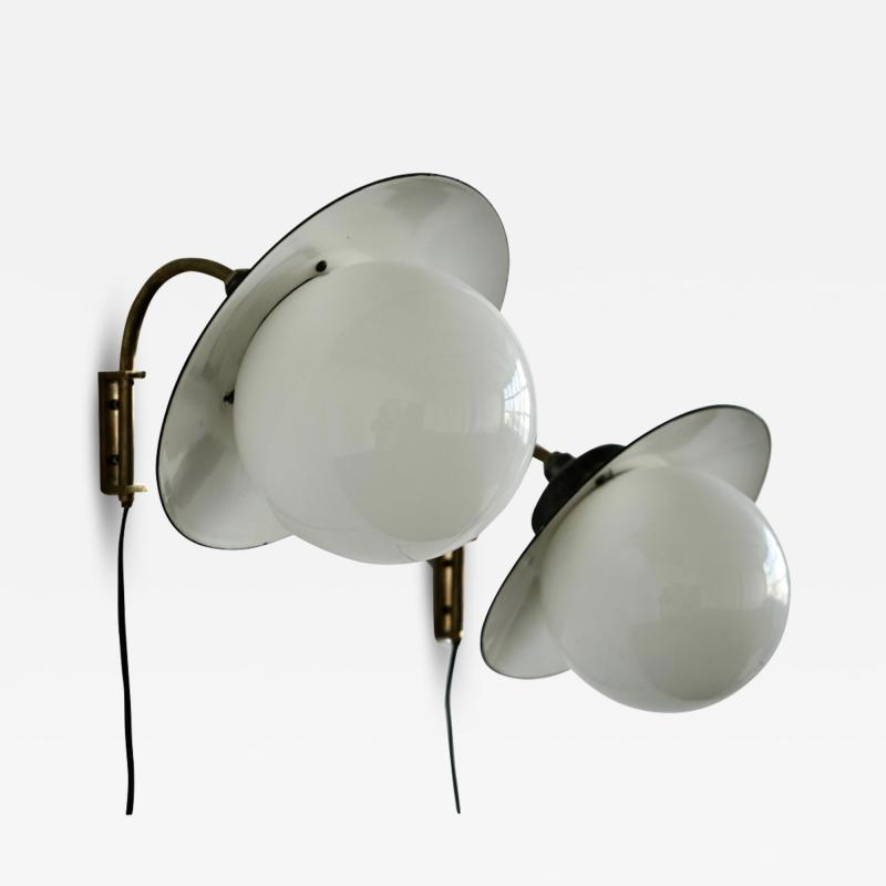 Paavo Tynell A pair of indoor outdoor wall lights by Paavo Tynell for Taito