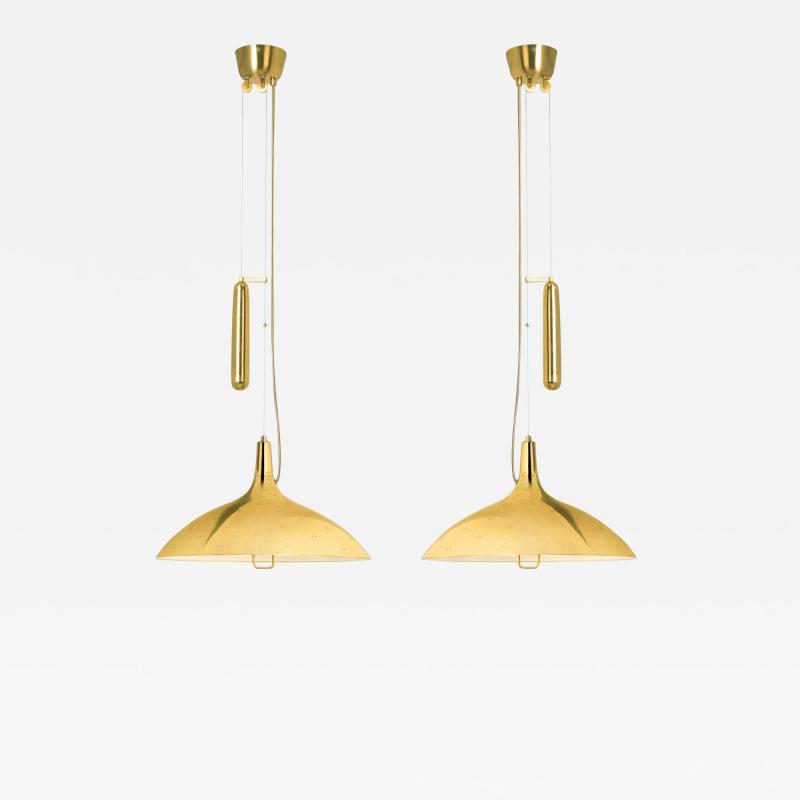 Paavo Tynell Pair of Counterbalance ceiling lamps model 10202 by Paavo Tynel