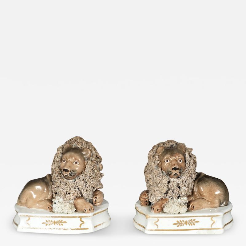 Pair Of European Porcelain Figures of Reclining Lions