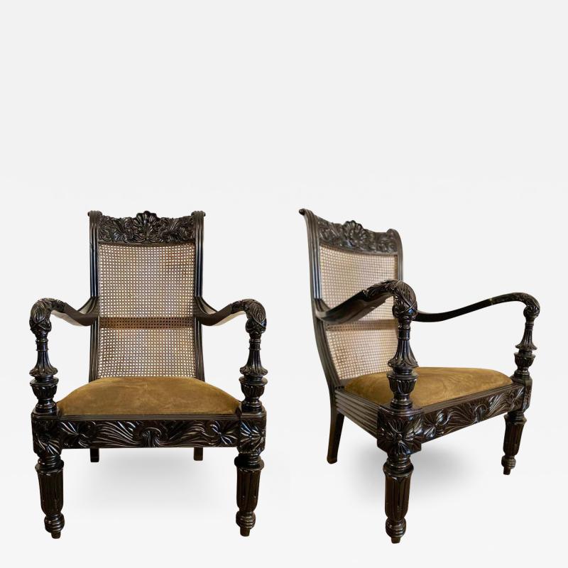 Pair of Anglo Indian Carved Ebony and Caned Armchairs