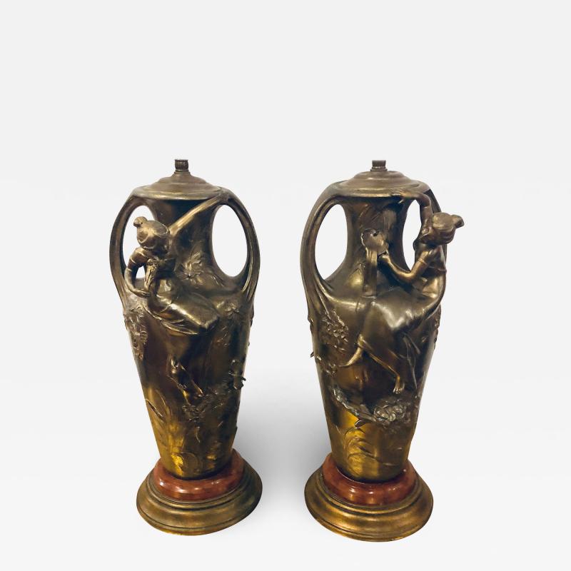 Pair of Art Nouveau Figural Urns Mounted as Lamps