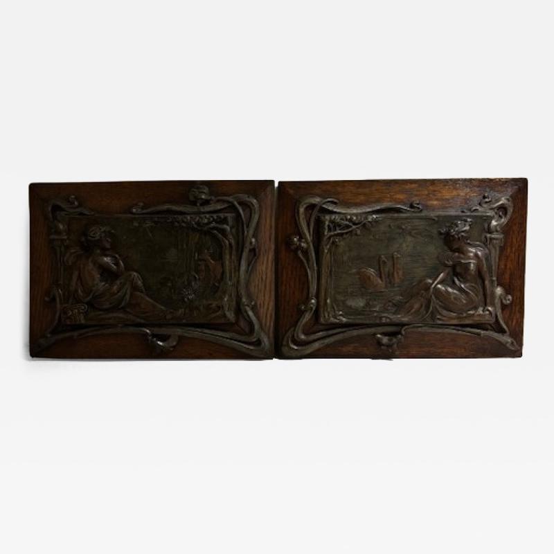 Pair of Art Nouveau Metal and Oak Figural Wall Plaque