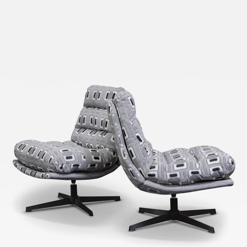 Pair of Black and White Swivel Lounge Chairs