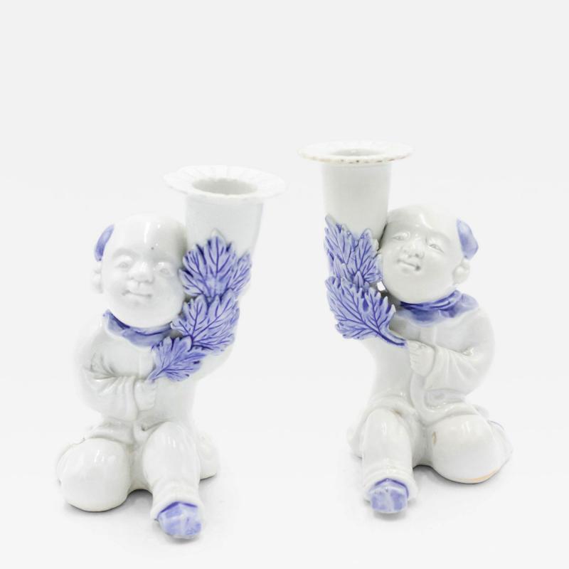 Pair of Chinese Blue and White Porcelain Figural Candlesticks