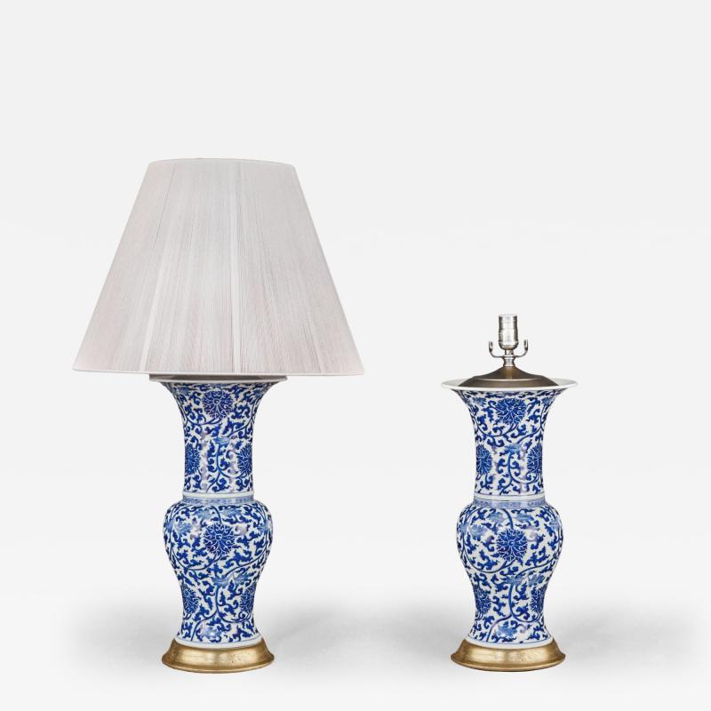 Pair of Chinese Blue and White Porcelain Fish Tail Lamps on Gilt Bases