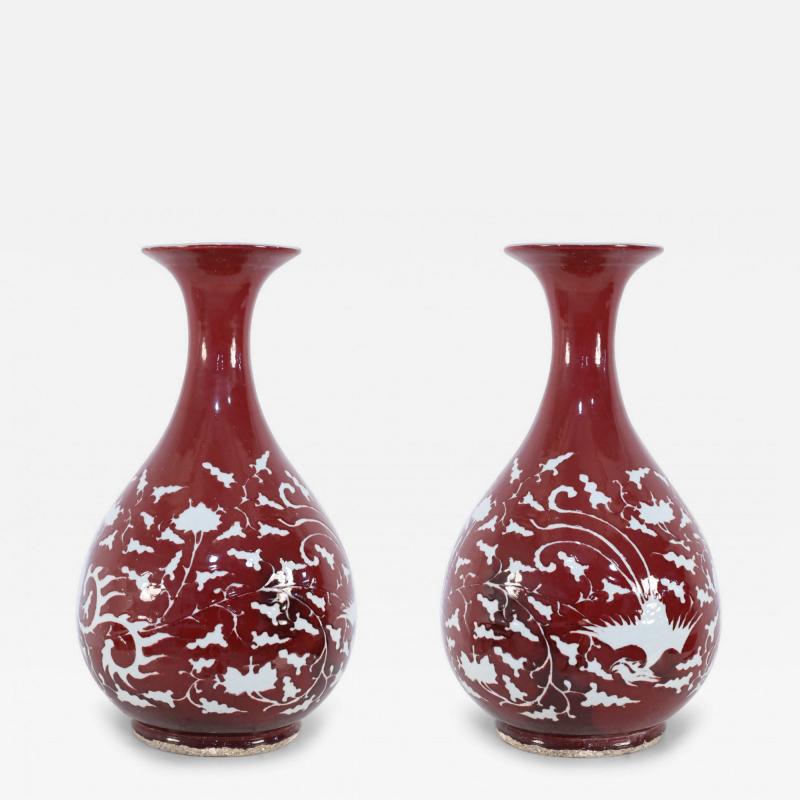 Pair of Chinese Burgundy and White Botanical Motif Porcelain Vases