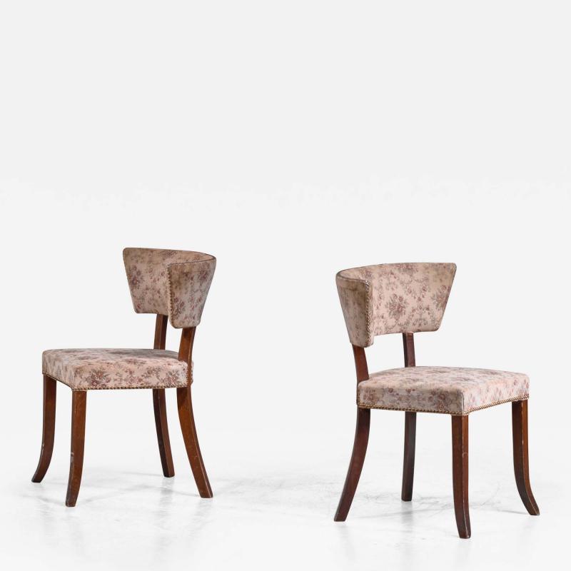 Pair of Danish side chairs with curved backrest